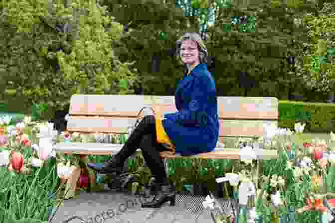 A Woman Sitting On A Park Bench, Surrounded By Blooming Flowers Our Dogs Ourselves: The Story Of A Singular Bond