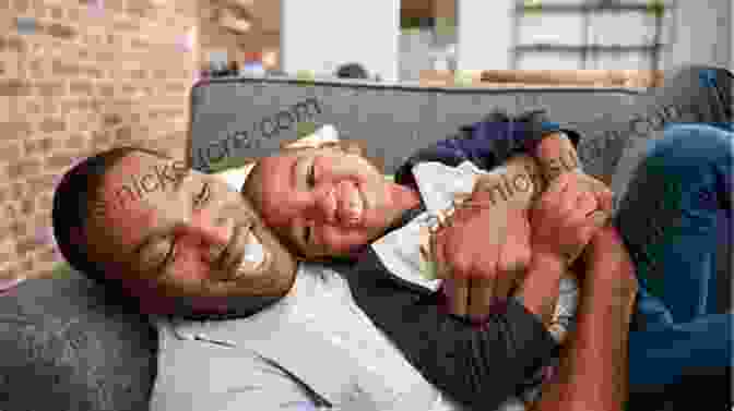 Father And Son Playing And Laughing Together, Symbolizing The Importance Of Fatherhood In Raising Boys Bringing Up Boys James C Dobson